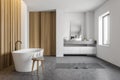 White and wood bathroom interior, side view Royalty Free Stock Photo