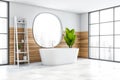 White and wood corner bathroom with tub and mirror Royalty Free Stock Photo