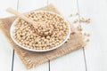 White wood floor cup with soybean,soybeans in white bowl with wooden spoon on table wooden Royalty Free Stock Photo