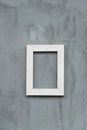 White wood picture frame on grunge grey concrete cement wall home interior background Royalty Free Stock Photo