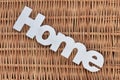 White Wood Sign Home On The Rustic Wicker Background Royalty Free Stock Photo