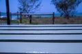 White Wood Table with Blurred Beach at Background