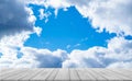 White Wood table top with Blue sky and clouds background,Empty Wooden table texture on Sky with free from fluffy cloud border in Royalty Free Stock Photo