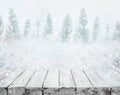 White wood table top on blurred snowfall in winter season Royalty Free Stock Photo
