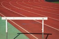 White wood training hurdle race on red running in sport stadium Royalty Free Stock Photo