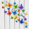 White wooden background with multicolored butterflies