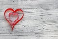 On a white wooden background of ribbons made two hearts. Valenti Royalty Free Stock Photo