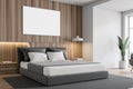 White and wooden bedroom corner with poster Royalty Free Stock Photo