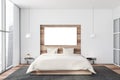 White and wooden bedroom with horizontal poster Royalty Free Stock Photo