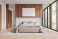 White and wooden bedroom interior with poster Royalty Free Stock Photo