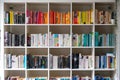 White wooden bookcase filled with books in a UK home Royalty Free Stock Photo
