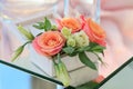 White wooden box with fresh flowers stands on a mirrored table Royalty Free Stock Photo