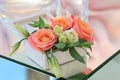 White wooden box with fresh flowers stands on a mirrored table Royalty Free Stock Photo