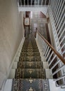 White wooden carpeted residential staircase