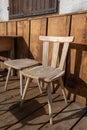 White wooden chair outside the dondena refuge in aosta valley, italy Royalty Free Stock Photo