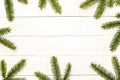 White wooden Christmas background. Border decorated fir branches Royalty Free Stock Photo