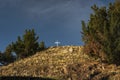 White cross on hilltop