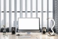 White wooden designer workplace with empty mock up computer screen, loud speakers and other items. Window frame with city view in Royalty Free Stock Photo