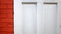 White Wooden Door Next to Red Brick Wall Close Up Royalty Free Stock Photo