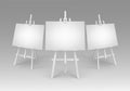 White Wooden Easels with Empty Blank Canvases