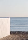 A white wooden fence against the sea Royalty Free Stock Photo