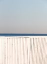 A white wooden fence against the sea Royalty Free Stock Photo