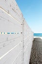 A white wooden fence on the beach Royalty Free Stock Photo