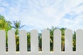 White wooden fence isolated the abstract blur of beach and luxury hotel restaurant background that separates the objects Royalty Free Stock Photo