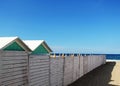 A white wooden fence with some booths Royalty Free Stock Photo