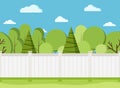 White wooden fence with trees. Modern rural white fence with green grass Royalty Free Stock Photo