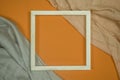 The white wooden frame arranges the elements on the fabric Royalty Free Stock Photo
