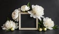 White wooden frame decorated with peonies flowers, botanical floral composition on black background Royalty Free Stock Photo