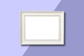 White wooden frame on purple background.