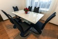 White wooden and glass round dining table with six chairs. Modern design, dining table and chairs in contemporary kitchen. Series