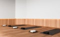 White and wooden gym corner with yoga mats