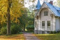 White wooden house with a garden walk