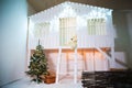 A white wooden house for playing children is decorated for Christmas and New Year. The facade in the New Year`s style Royalty Free Stock Photo