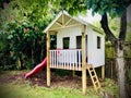 Kids Playhouse with red Slide.