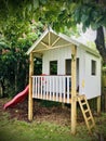 Kids Playhouse with red Slide. Vertical photo image. Royalty Free Stock Photo