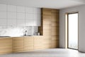 White and wooden kitchen corner with cupboards Royalty Free Stock Photo