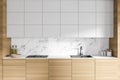 White and wooden kitchen with cupboards, close up