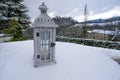 White wooden lantern with candle across the winter mountain landscape. Traditional. Holiday. Christmas Royalty Free Stock Photo