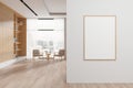 White and wooden living room interior with bookcase and poster Royalty Free Stock Photo