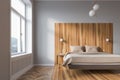 White and wooden master bedroom interior Royalty Free Stock Photo