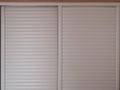 White shutter style wardrobe sliding door