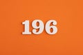 Number 196 - On orange foam rubber background