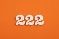 Number 222 - On orange foam rubber background