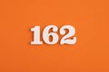 Number 162 - On orange foam rubber background