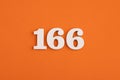 Number 166 - On orange foam rubber background