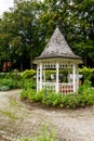 White wooden gazebo in a garden or park Royalty Free Stock Photo